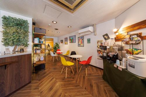 a store with chairs and tables in a room at Hotel Nomad - Vacation STAY 74191v in Hitachi