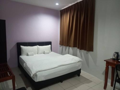 Katil atau katil-katil dalam bilik di Reintree Lodge Hotel Ipoh