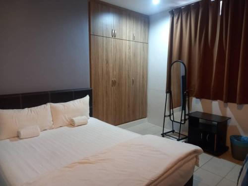 Katil atau katil-katil dalam bilik di Reintree Lodge Hotel Ipoh