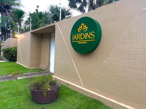 a sign on the side of a building at Pousada Jardins in São Luís