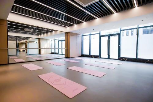 a large room with pink mats on the floor at Citadines Science City Guangzhou-Shuttle bus to Canton Fair Complex during Canton Fair period in Guangzhou