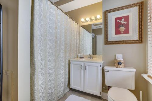 a bathroom with a toilet and a sink at 50 Lincoln Short North Bed & Breakfast in Columbus