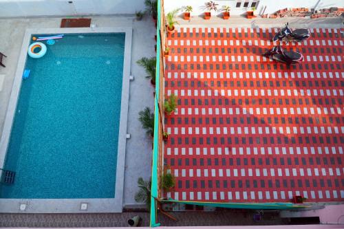 an overhead view of a swimming pool on a building at villaa eden in Puducherry