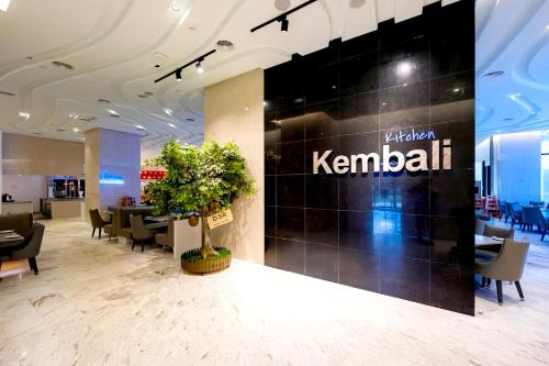 a lobby of a kennelitz restaurant with a large wall at Grand Ion Genting Highlands in Genting Highlands