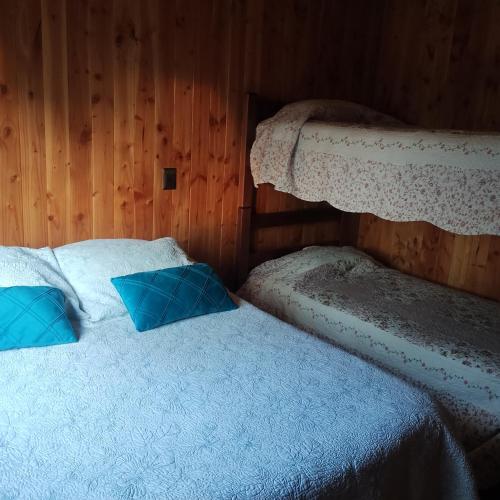 Postel nebo postele na pokoji v ubytování Refugio Pucura