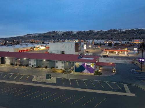 an aerial view of a city with a parking lot at Spark by Hilton Rock Springs in Rock Springs