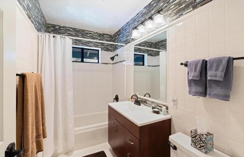 a bathroom with a sink and a mirror at Whole House at Eaglenest Inn with Pool & SPA in Julian