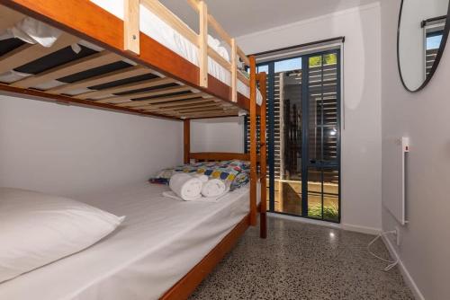 Postel nebo postele na pokoji v ubytování Ngongotaha Cottage