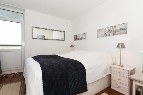 Ένα ή περισσότερα κρεβάτια σε δωμάτιο στο Haus Oland Whg 15