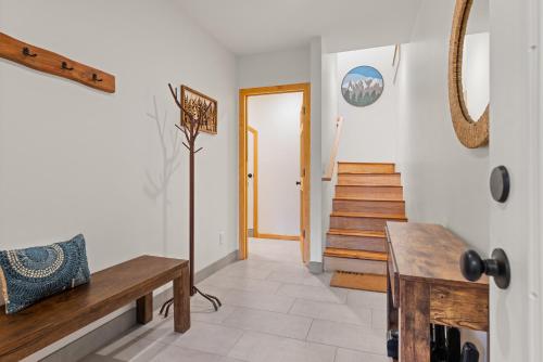 a living room with a wooden bench and stairs at Remodeled 4BDR Cabin with AC Lake Views Hot-Tub Bunk Room Excellent Location in Kings Beach