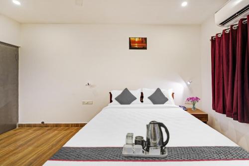 Ένα ή περισσότερα κρεβάτια σε δωμάτιο στο Townhouse ORCHID RESIDENCY Near T.Nagar