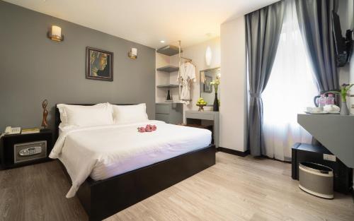 Cama o camas de una habitación en F L G Hotel