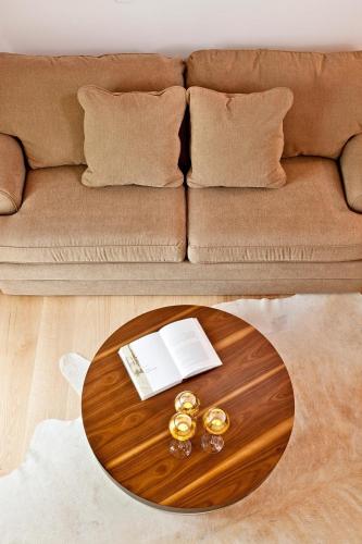 a coffee table in a living room with a couch at Kalavrita Canyon Hotel & Spa in Kalavrita