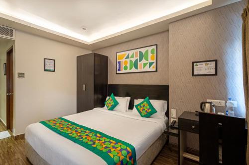 a bedroom with a large white bed in a room at Treebo Premium Twin Star in Chennai