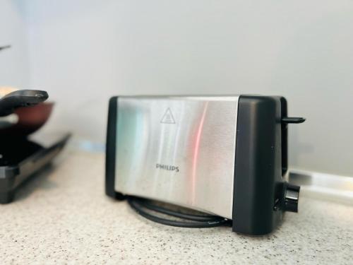 a toaster oven sitting on top of a counter at Pinnacle Pj by DeUrban in Petaling Jaya