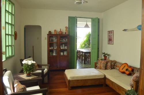 a living room with a couch and a table at Pousada Baluarte in Salvador