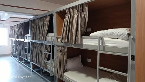 a group of bunk beds in a room at Savitri dormetry in Ayodhya