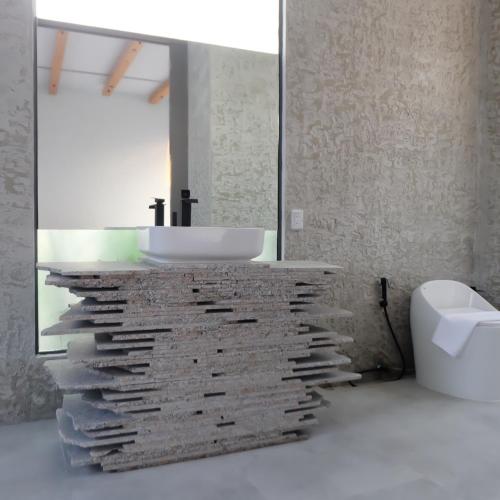a bathroom with a sink and a mirror at Huahin House Premium in Hua Hin
