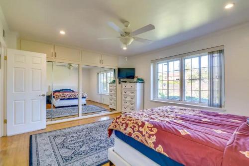 a bedroom with a bed and a dresser and a mirror at Vacation Rental w Pool &Garden 6 Guests near CSUN in North Hills