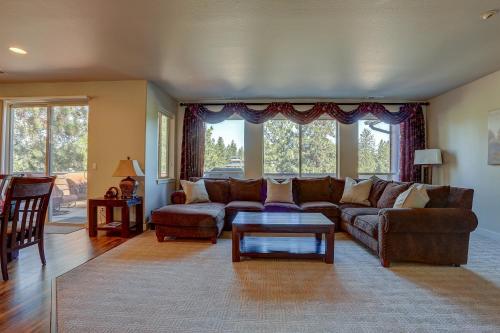 a living room with a couch and a table at Quinn Creek in Bend