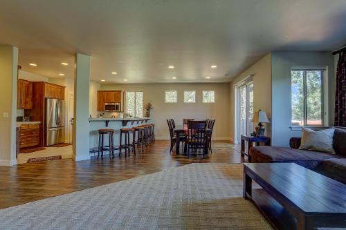 a living room and kitchen with a couch and a table at Quinn Creek in Bend