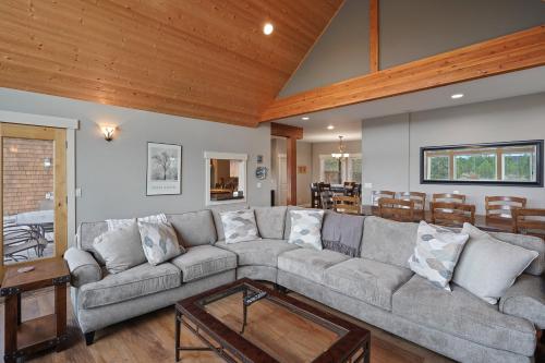 a living room with a couch and a table at Five Peaks in Bend