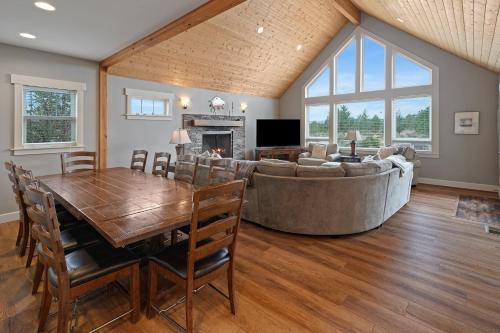 a living room with a table and a couch at Five Peaks in Bend