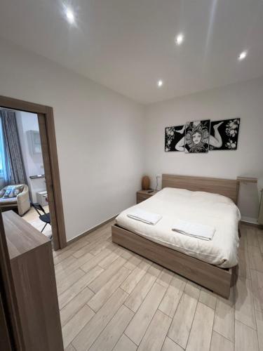 a bedroom with a bed and a large mirror at Avaja - Daria's apartment in Taormina