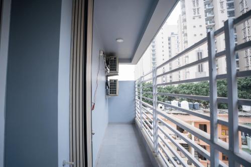a balcony with a view of a building at Orsom Stays Sassy - Sector 42 in Gurgaon