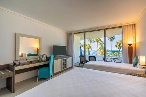 Ένα ή περισσότερα κρεβάτια σε δωμάτιο στο Sunrise Queen Luxury Hotel