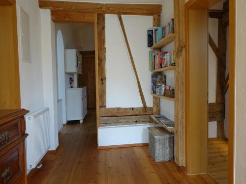 a living room with a window and a refrigerator at Apartment in Stans near Wolfsklamm River in Stans