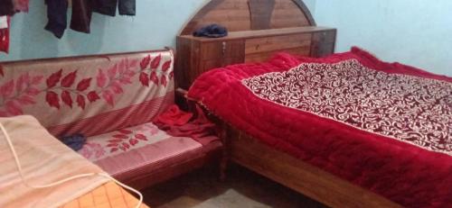 Katil atau katil-katil dalam bilik di Vinay homestay