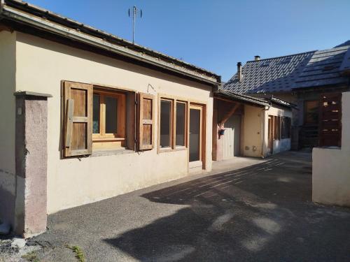 an empty street in an old building with windows at Améthyste in Val-des-Prés