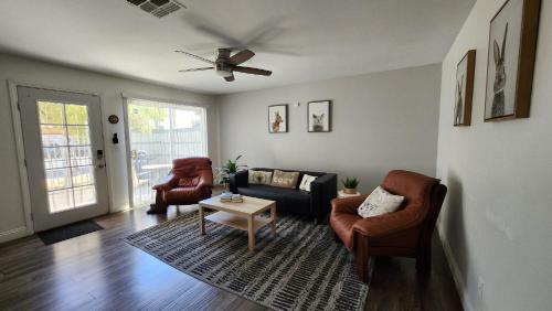 a living room with a couch and two chairs at L - Fully remodeled and professionally decorated in Las Vegas