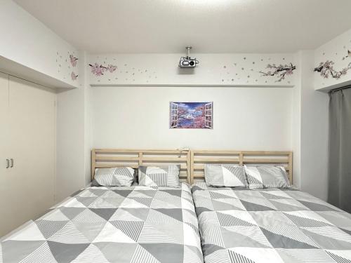 Postel nebo postele na pokoji v ubytování Shinjuku Wasedaハウス T3