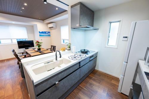 a kitchen with a sink and a stove at Newly Built 3-Story House in the Heart of Tokyo-Easy Access to Airports,Skytree in Tokyo