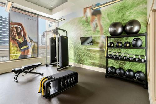 a room with a gym with a treadmill and exercise equipment at The Westin Warsaw in Warsaw