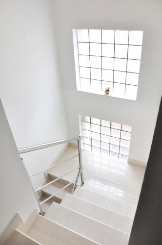 a staircase in a house with a window at Guest House Ćiro in Sarajevo