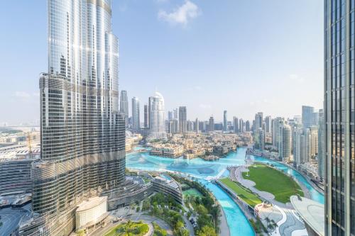 an aerial view of a city with tall buildings at Address Opera Residences Burj Khalifa View in Dubai