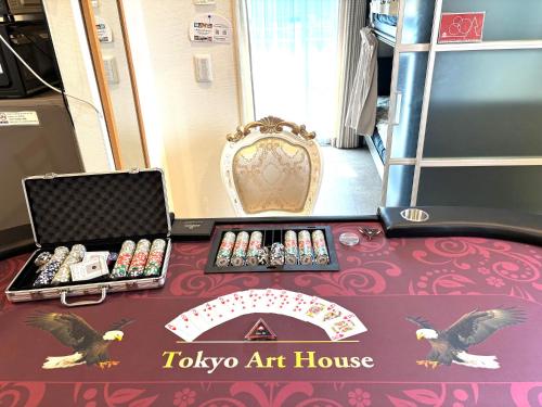 a table with a tokyo art house sign on it at Tokyo Art House in Tokyo