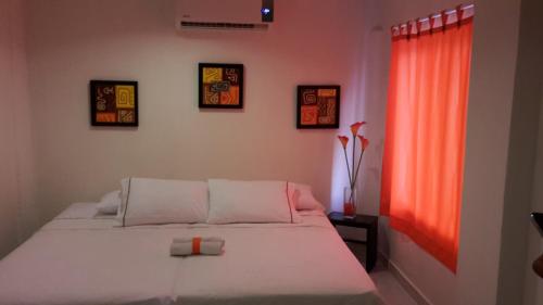 Postel nebo postele na pokoji v ubytování Manzanillo Beach