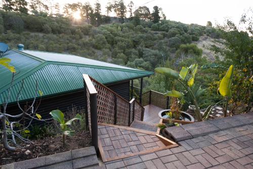 a staircase leading to a house with a green roof at Casa Salvador in Flagstaff Hill