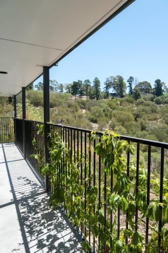 a balcony with plants on the side of a building at Casa Salvador in Flagstaff Hill