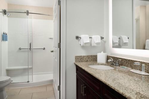a bathroom with a sink and a shower at Residence Inn Charlotte Uptown in Charlotte