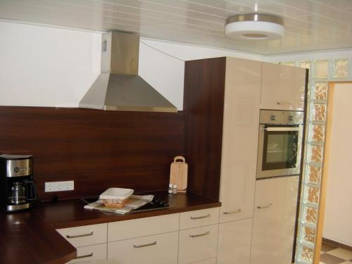 a kitchen with a sink and a stove top oven at Kietzke in Eckernförde