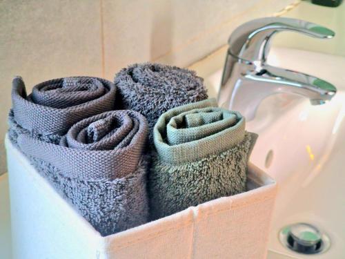 a basket of towels sitting next to a sink at Luxury Villa Azure in Larnaka
