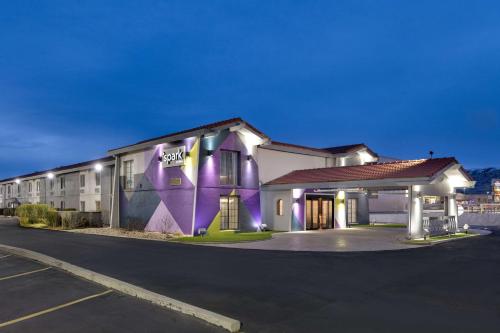 a building with a sign on the side of it at Spark by Hilton Rock Springs in Rock Springs