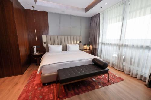 Ένα ή περισσότερα κρεβάτια σε δωμάτιο στο Hilton Samarkand Regency