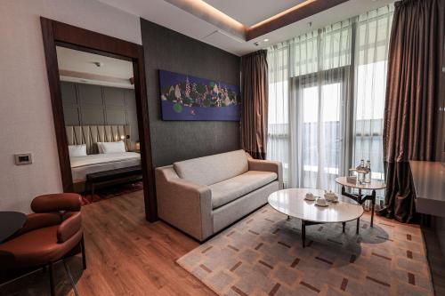 Ένα ή περισσότερα κρεβάτια σε δωμάτιο στο Hilton Samarkand Regency