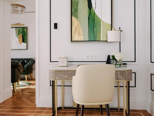 a dining room with a table and two chairs at The Burman Hotel in Tallinn